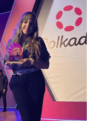 Silvia Mogas on stage with the 3rd place trophy at the Polkadot Championship Hackathon, Bali, 2024